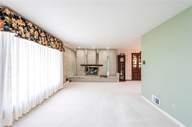 1515 George St, Unity Twp, PA 15650 - unfurnished living room with light colored carpet and wallpapered walls