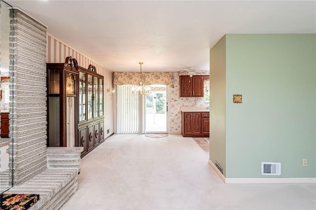 1515 George St, Unity Twp, PA 15650 - unfurnished dining area featuring a chandelier, light colored carpet, and wallpapered walls