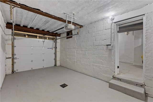 3322 Webster Ave, Schenley Heights, PA 15219 - garage featuring a garage door opener and concrete block wall