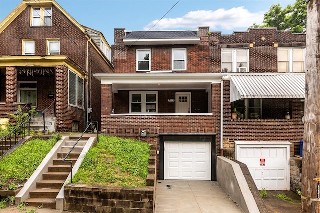 3322 Webster Ave, Schenley Heights, PA 15219 - view of front facade featuring brick siding, concrete driveway, an attached garage, and stairs