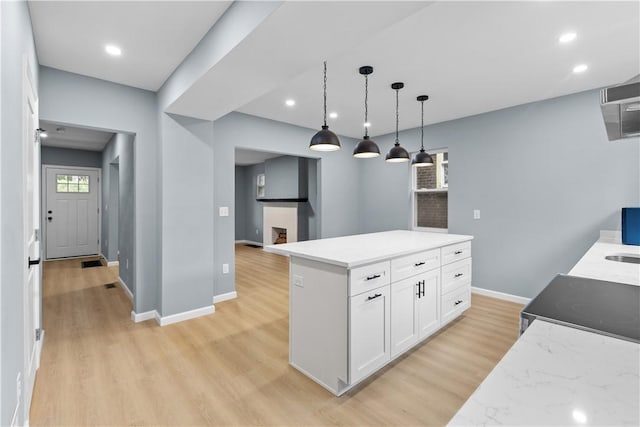 3322 Webster Ave, Schenley Heights, PA 15219 - kitchen with white cabinetry, light wood-style flooring, hanging light fixtures, recessed lighting, and a center island