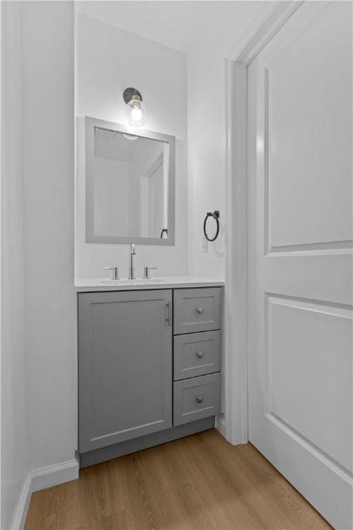 3322 Webster Ave, Schenley Heights, PA 15219 - bathroom featuring wood finished floors and vanity
