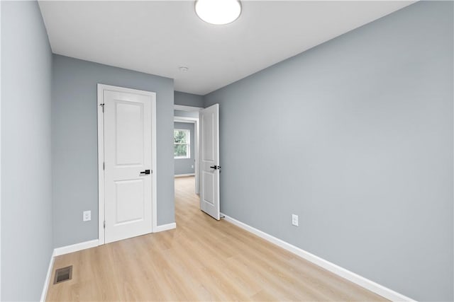 3322 Webster Ave, Schenley Heights, PA 15219 - unfurnished bedroom with baseboards and light wood finished floors