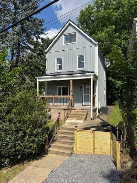 1713 Belasco Ave, Beechview, PA 15216 - view of front of house with a porch, board and batten siding, and stairway