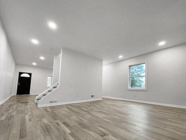 1713 Belasco Ave, Beechview, PA 15216 - unfurnished living room featuring wood finished floors, recessed lighting, and stairs