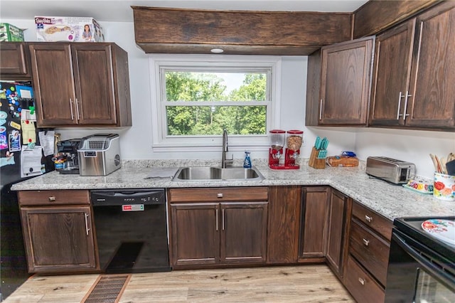 132 Spaugy Hollow Rd, Bullskin Twp, PA 15425 - kitchen featuring black appliances, light wood-type flooring, light stone counters, and dark brown cabinetry