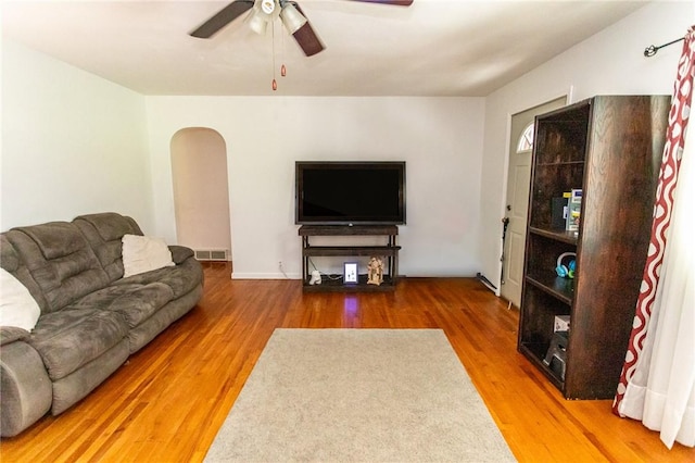 132 Spaugy Hollow Rd, Bullskin Twp, PA 15425 - living room featuring ceiling fan, wood finished floors, and arched walkways