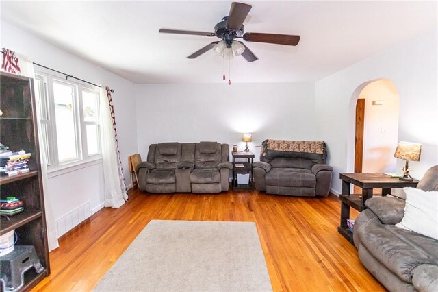 132 Spaugy Hollow Rd, Bullskin Twp, PA 15425 - living area featuring arched walkways, light wood-type flooring, and ceiling fan