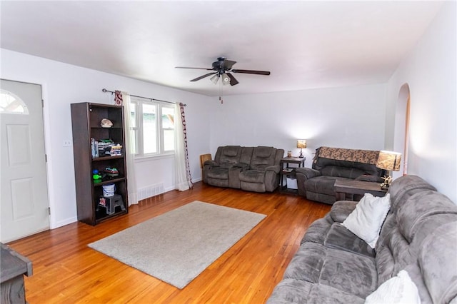 132 Spaugy Hollow Rd, Bullskin Twp, PA 15425 - living room with a ceiling fan, arched walkways, and wood finished floors