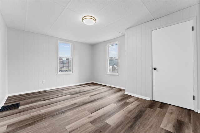 613-615 W Main St, Carnegie, PA 15106 - unfurnished bedroom with wood finished floors, multiple windows, and a drop ceiling
