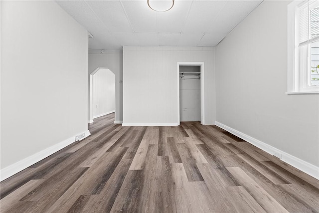 613-615 W Main St, Carnegie, PA 15106 - unfurnished bedroom with wood finished floors, arched walkways, and a closet