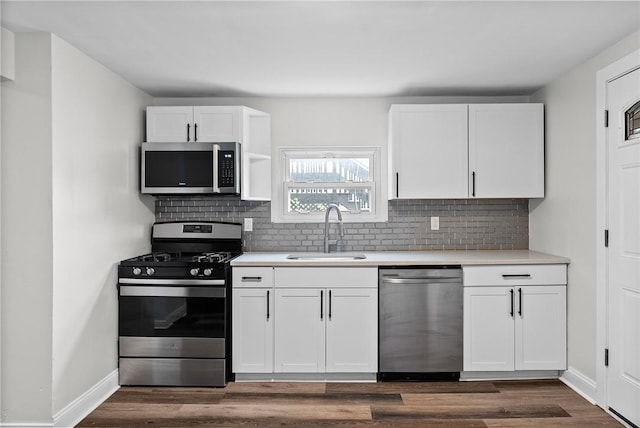 613-615 W Main St, Carnegie, PA 15106 - kitchen featuring stainless steel appliances, white cabinets, light countertops, and backsplash