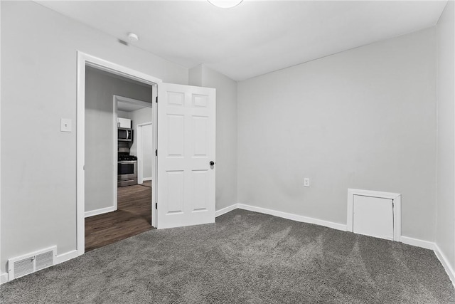 613-615 W Main St, Carnegie, PA 15106 - spare room featuring dark carpet and baseboards