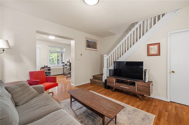 316 Kaercher St, Greenfield, PA 15207 - living area featuring radiator, stairway, and wood finished floors