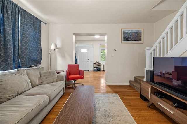 316 Kaercher St, Greenfield, PA 15207 - living room featuring stairway, wood finished floors, and radiator