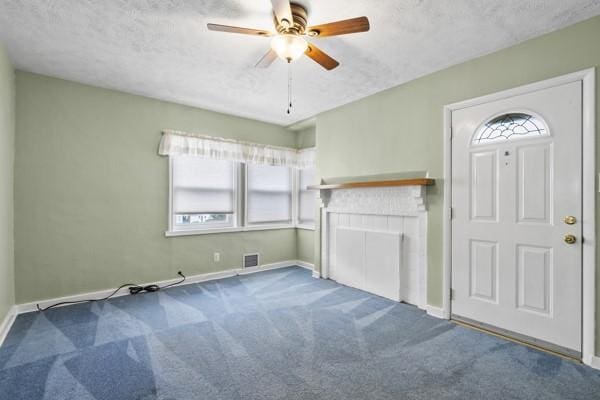 110 5th Ave, Ross Twp, PA 15229 - unfurnished living room with carpet, a textured ceiling, and ceiling fan