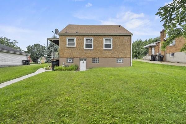 110 5th Ave, Ross Twp, PA 15229 - rear view of house featuring a lawn and brick siding