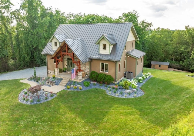 2780 Ipnar Rd, North Huntingdon, PA 15642 - view of front facade featuring covered porch, stone siding, a front yard, and a metal roof