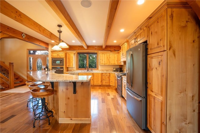 2780 Ipnar Rd, North Huntingdon, PA 15642 - kitchen featuring stainless steel appliances, recessed lighting, light wood-style floors, a kitchen breakfast bar, and beam ceiling