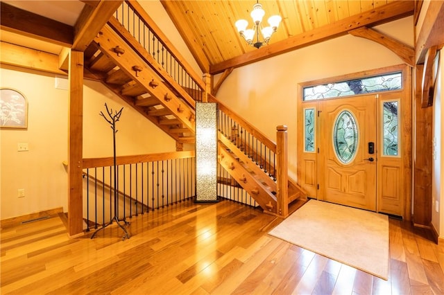2780 Ipnar Rd, North Huntingdon, PA 15642 - entryway featuring hardwood / wood-style flooring, a chandelier, beam ceiling, and stairway