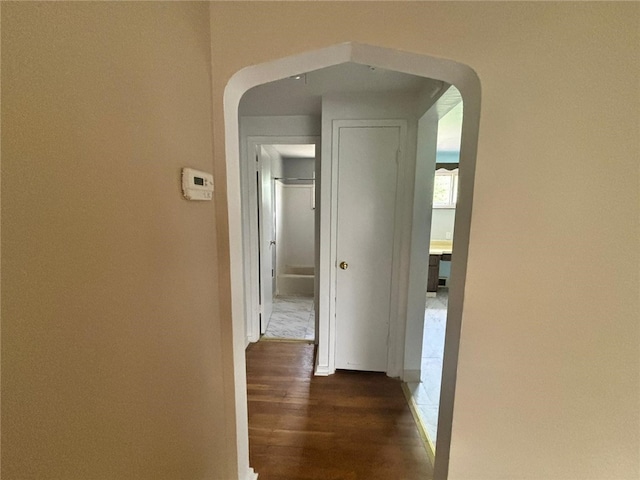 270 Wheeler Ave, Stowe Twp, PA 15136 - hallway with arched walkways and dark wood-style floors