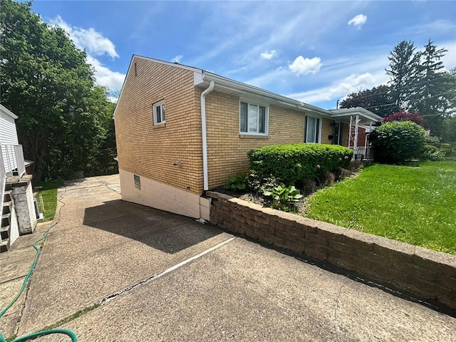 270 Wheeler Ave, Stowe Twp, PA 15136 - view of side of property with a yard, brick siding, and crawl space