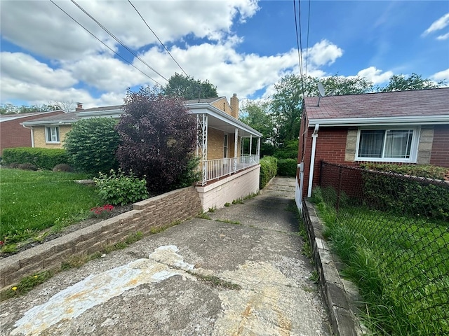 270 Wheeler Ave, Stowe Twp, PA 15136 - view of side of property with brick siding, covered porch, and driveway