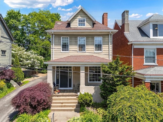 224 Bronx Ave, West View, PA 15229 - american foursquare style home featuring covered porch, a chimney, and brick siding