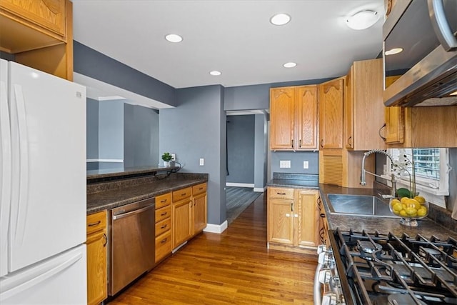 224 Bronx Ave, West View, PA 15229 - kitchen featuring appliances with stainless steel finishes, wood finished floors, dark countertops, and recessed lighting