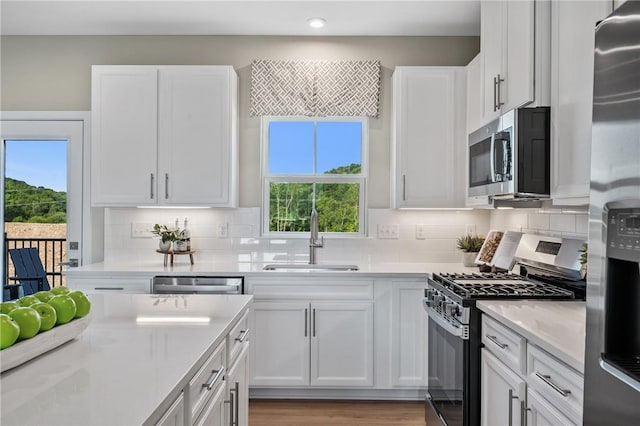 214 Hunter Dr, Moon/Crescent Twp, PA 15108 - kitchen featuring stainless steel appliances, plenty of natural light, white cabinets, and recessed lighting