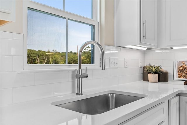 214 Hunter Dr, Moon/Crescent Twp, PA 15108 - kitchen view of backsplash, white cabinetry, and light countertops