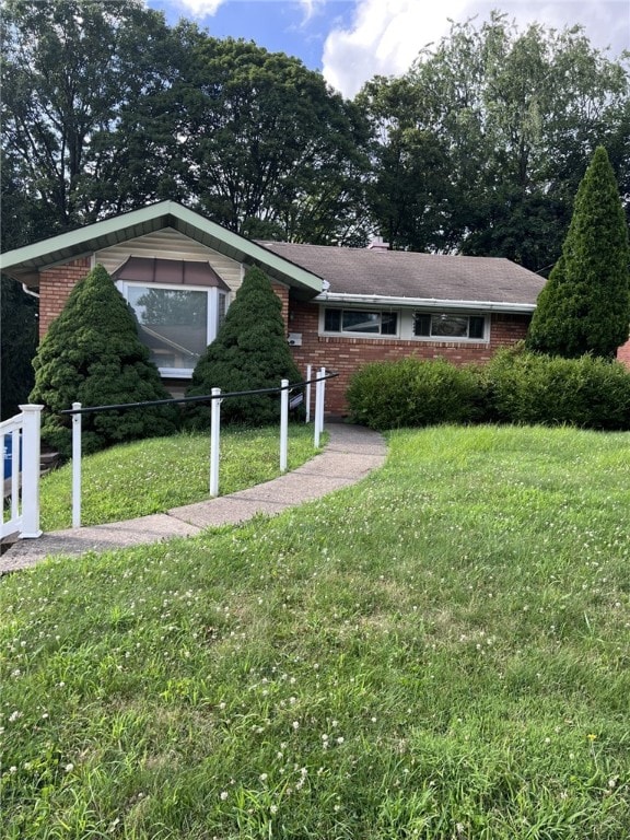 115 Frazier, Wilkins Twp, PA 15235 - ranch-style house featuring brick siding and a front lawn