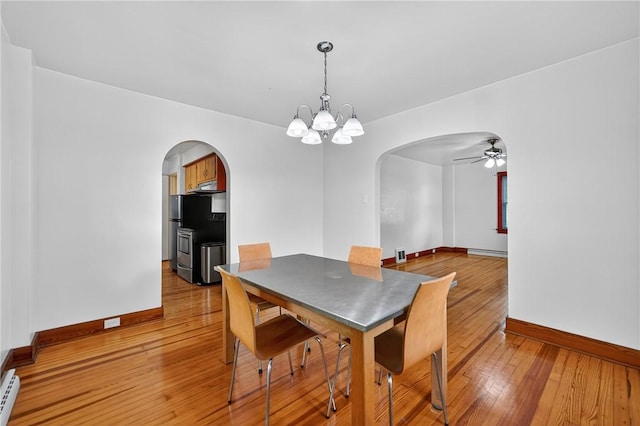 1605 Maratta Rd, Hopewell Twp, PA 15001 - dining room featuring arched walkways, ceiling fan, a chandelier, light wood-style flooring, and a baseboard radiator