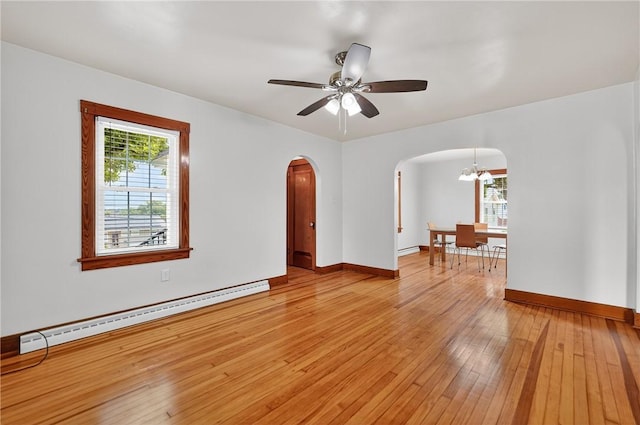 1605 Maratta Rd, Hopewell Twp, PA 15001 - unfurnished room with a baseboard radiator, arched walkways, light wood-style floors, a chandelier, and ceiling fan