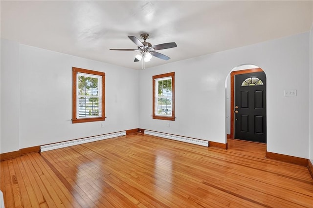 1605 Maratta Rd, Hopewell Twp, PA 15001 - unfurnished room featuring a baseboard heating unit, arched walkways, and plenty of natural light