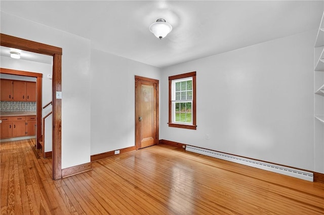 1605 Maratta Rd, Hopewell Twp, PA 15001 - empty room featuring a baseboard heating unit and light wood finished floors