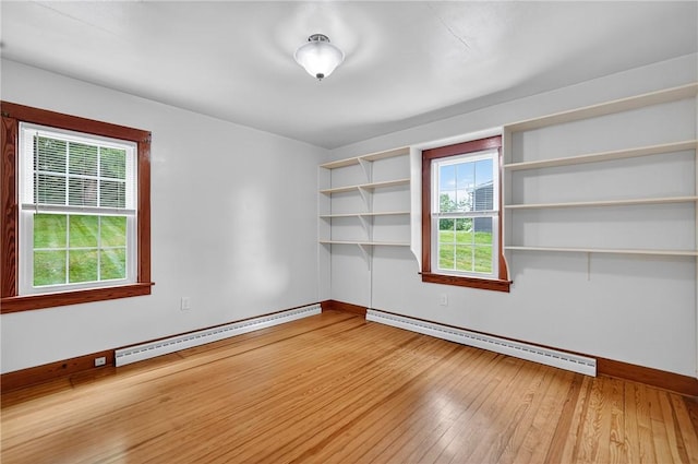 1605 Maratta Rd, Hopewell Twp, PA 15001 - spare room with a baseboard radiator, a baseboard heating unit, wood-type flooring, and plenty of natural light