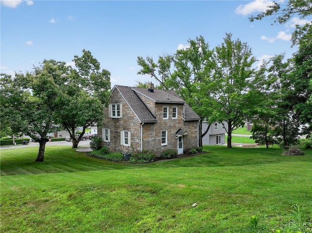 1605 Maratta Rd, Hopewell Twp, PA 15001 - view of property exterior with stone siding, a lawn, and a chimney