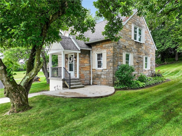 1605 Maratta Rd, Hopewell Twp, PA 15001 - view of front of home featuring stone siding, roof with shingles, and a front yard