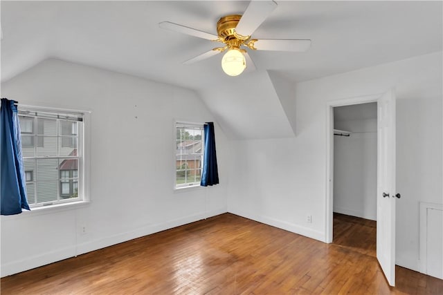 1255 Park Pl, Beaver, PA 15009 - unfurnished bedroom featuring lofted ceiling, wood-type flooring, a closet, ceiling fan, and a walk in closet