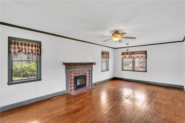 1255 Park Pl, Beaver, PA 15009 - unfurnished living room with crown molding, a ceiling fan, a fireplace, and wood finished floors