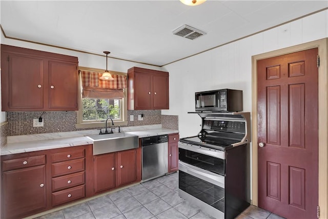 1255 Park Pl, Beaver, PA 15009 - kitchen featuring stainless steel appliances, backsplash, light tile patterned flooring, and hanging light fixtures