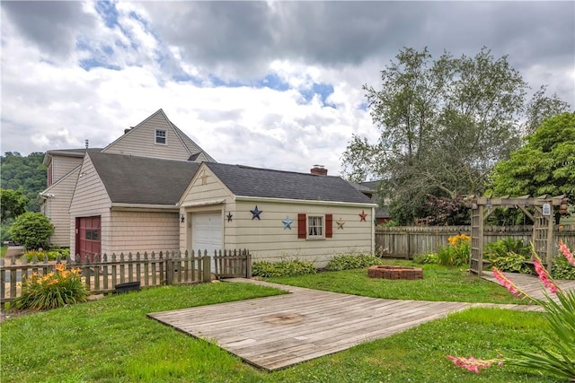 1255 Park Pl, Beaver, PA 15009 - rear view of property featuring an attached garage and a wooden deck