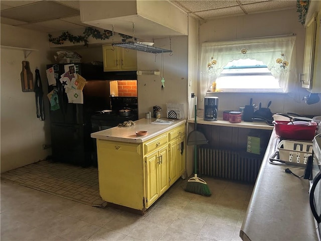 1175 New Salem Rd, Menallen Twp, PA 15468 - kitchen featuring a paneled ceiling, light countertops, and radiator heating unit
