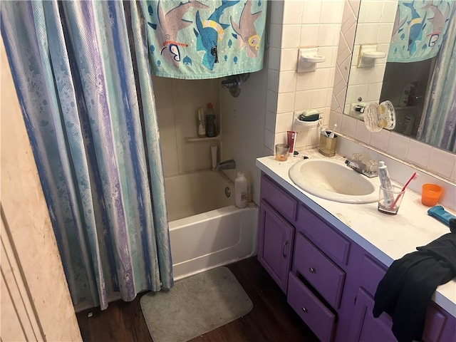 1175 New Salem Rd, Menallen Twp, PA 15468 - bathroom with vanity, wood finished floors, shower / bath combo, backsplash, and tile walls