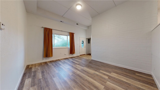 120 Rivermont Ct, Harmar, PA 15024 - spare room featuring brick wall and wood finished floors