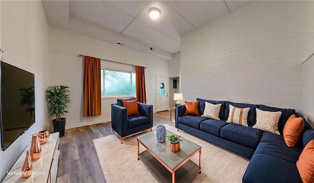 120 Rivermont Ct, Harmar, PA 15024 - living room featuring wood finished floors and brick wall