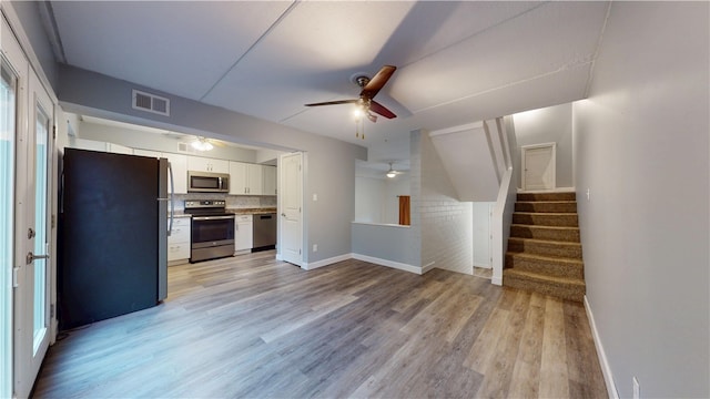 120 Rivermont Ct, Harmar, PA 15024 - unfurnished living room with ceiling fan, light wood-type flooring, and stairway