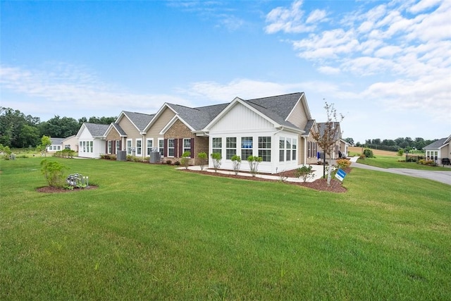 1082 Forest Oaks Dr, Center Twp, PA 16001 - view of front of property featuring a front lawn, board and batten siding, and brick siding