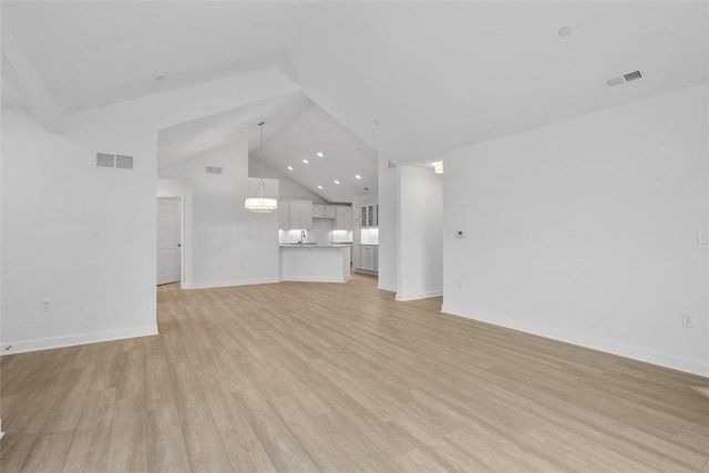 1082 Forest Oaks Dr, Center Twp, PA 16001 - unfurnished living room with light wood-style floors and high vaulted ceiling